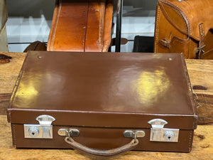 A Large Vintage Tan Leather Suitcase With Chrome Studs